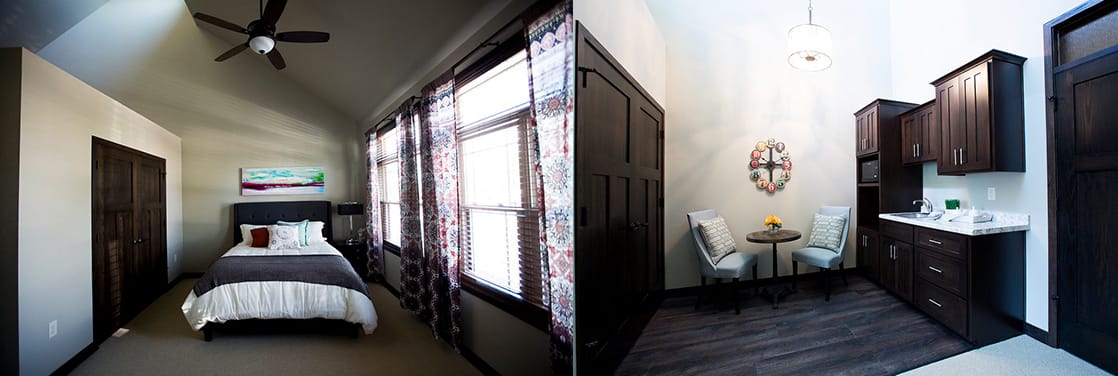 A cozy bedroom with a modern design and amenities