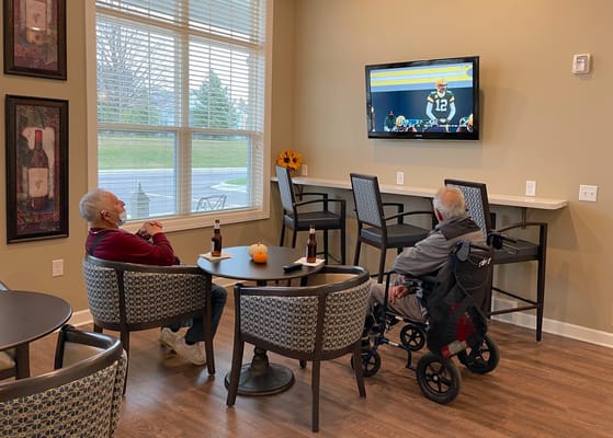Residents enjoying TV in a common area