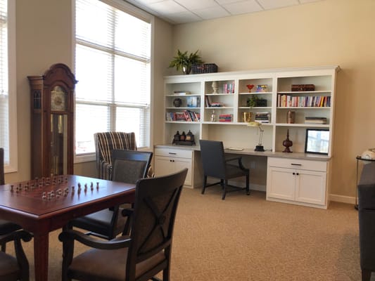 Interior common area with seating and a game table