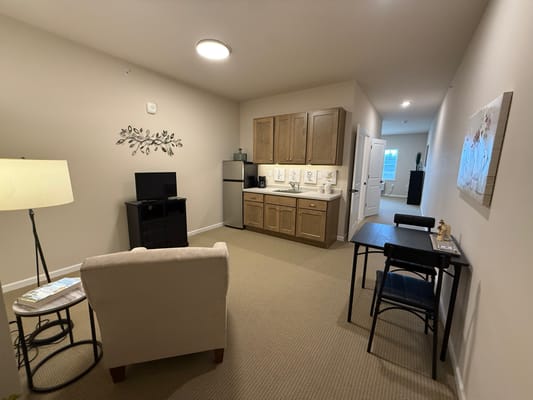 Interior view of a resident unit with kitchen and living area
