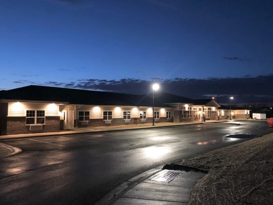 Exterior view of the Archwood Senior Living facility at dusk