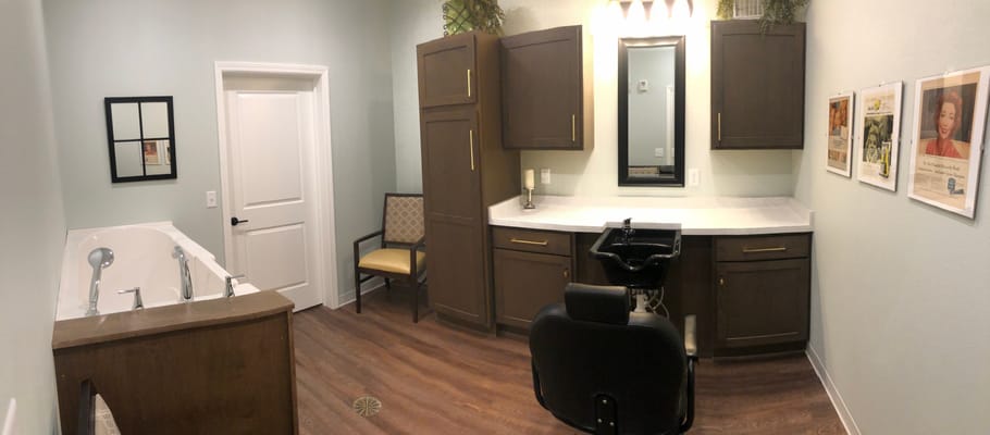 Interior of a salon area with styling chair and sink