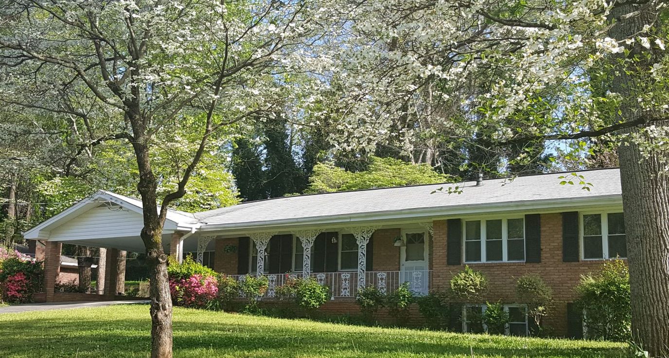 Exterior view of Shadybrook Assisted Living surrounded by nature