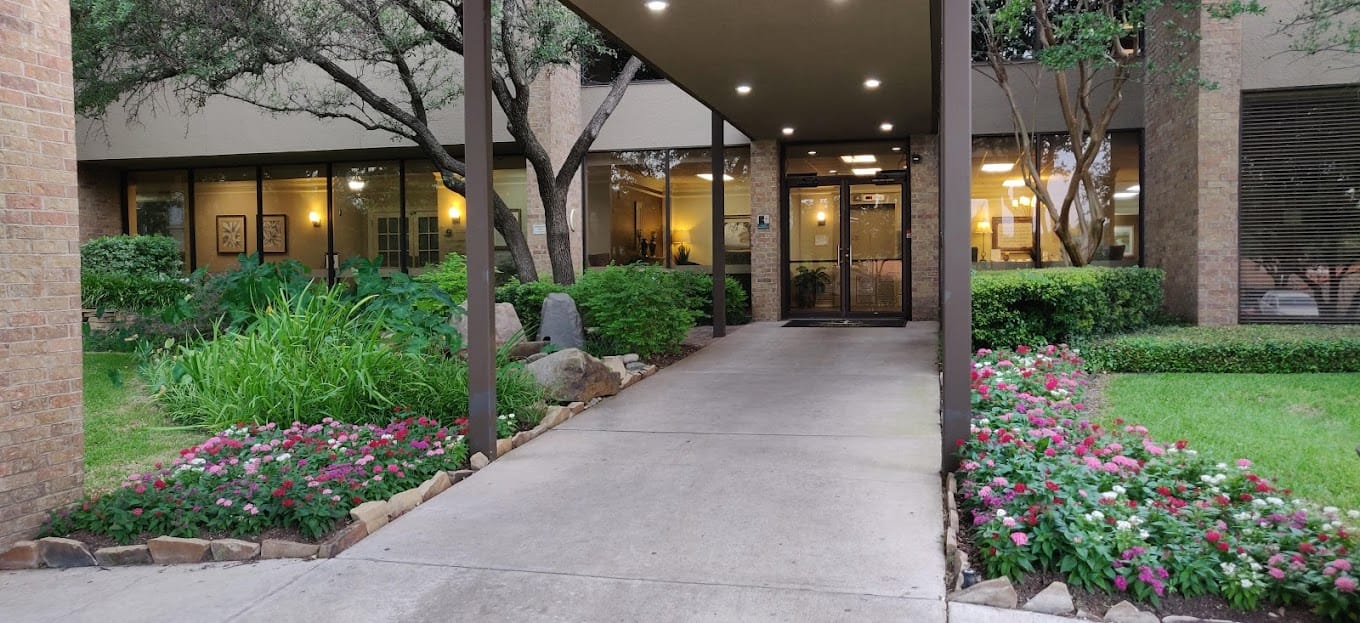 Exterior view of the entrance with landscaped garden