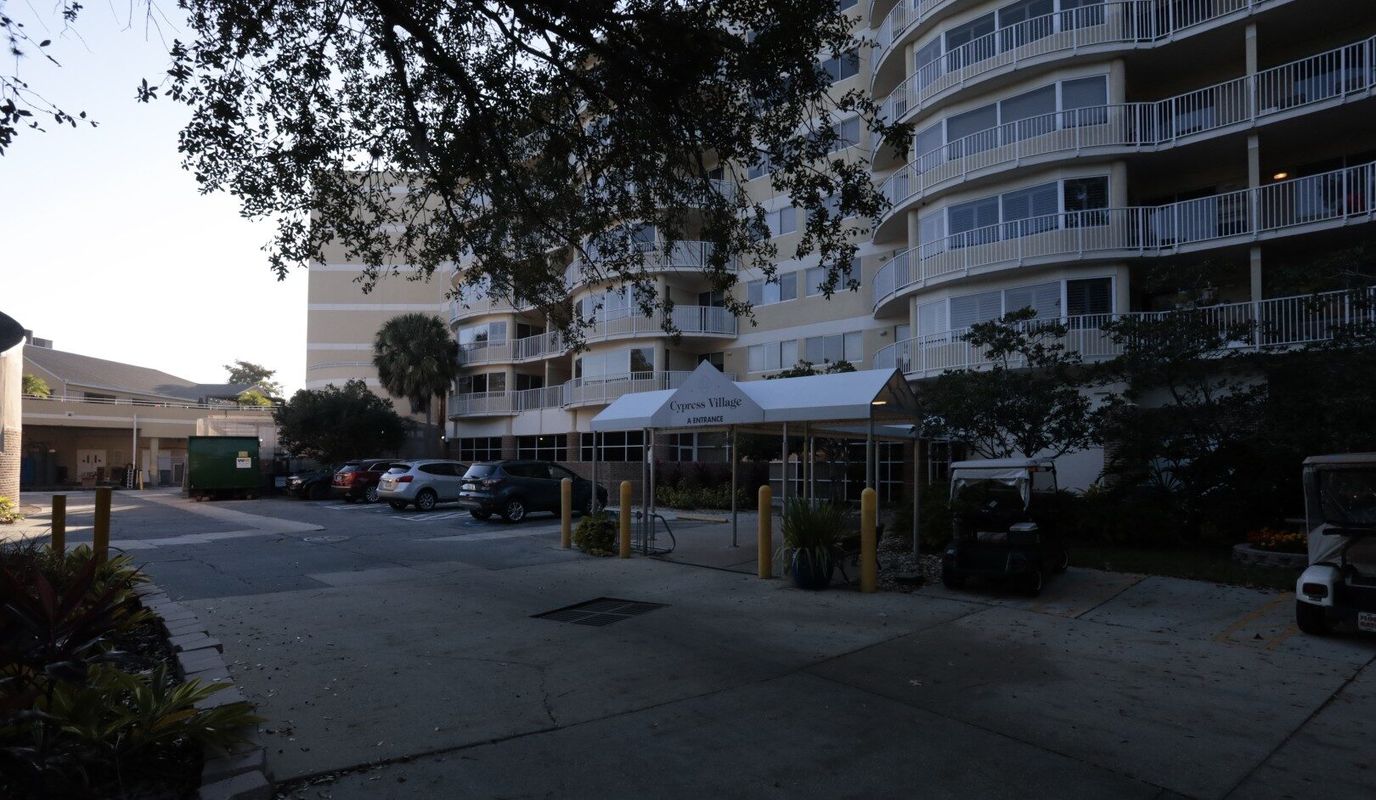 Building entrance of Cypress Village senior living facility