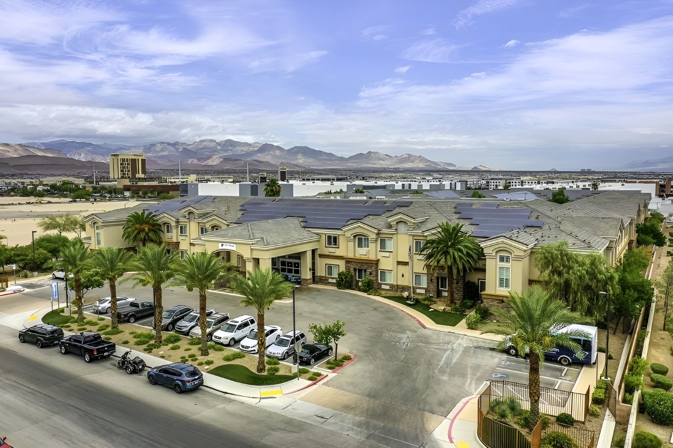 Exterior view of San Martin Senior Living facility with surrounding landscape