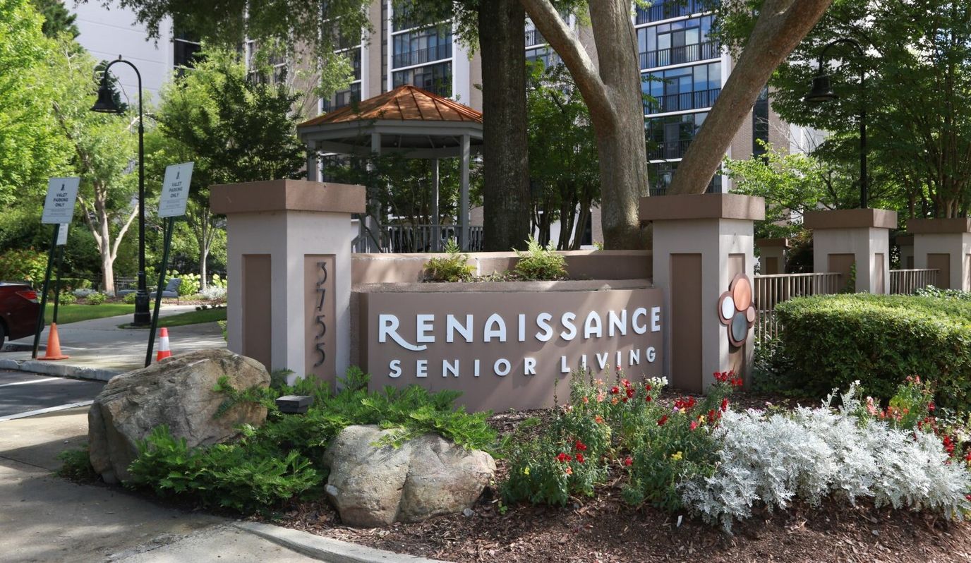 Entrance sign of Renaissance Senior Living with landscaping