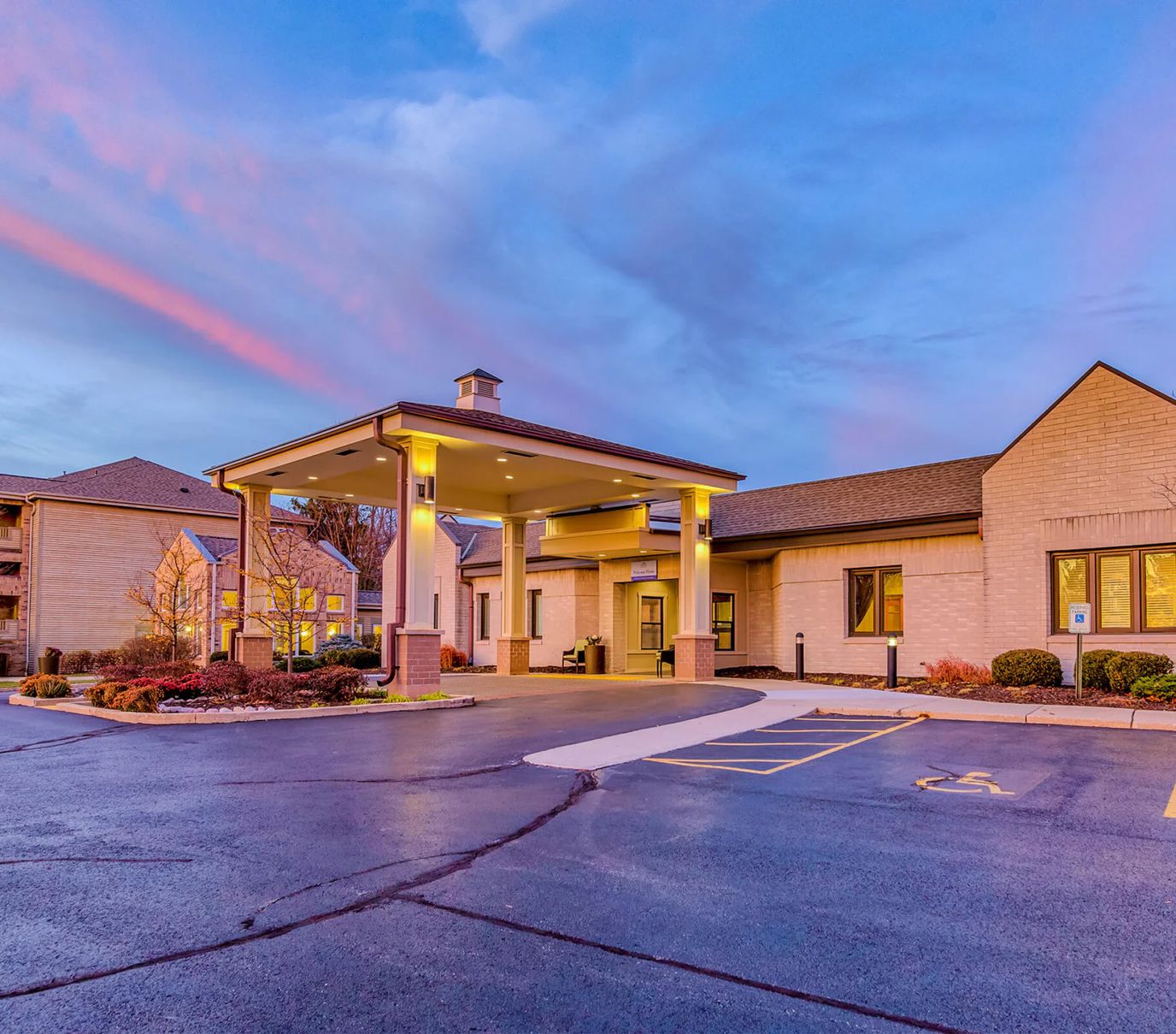 Exterior view of Harbour Village with sunset sky