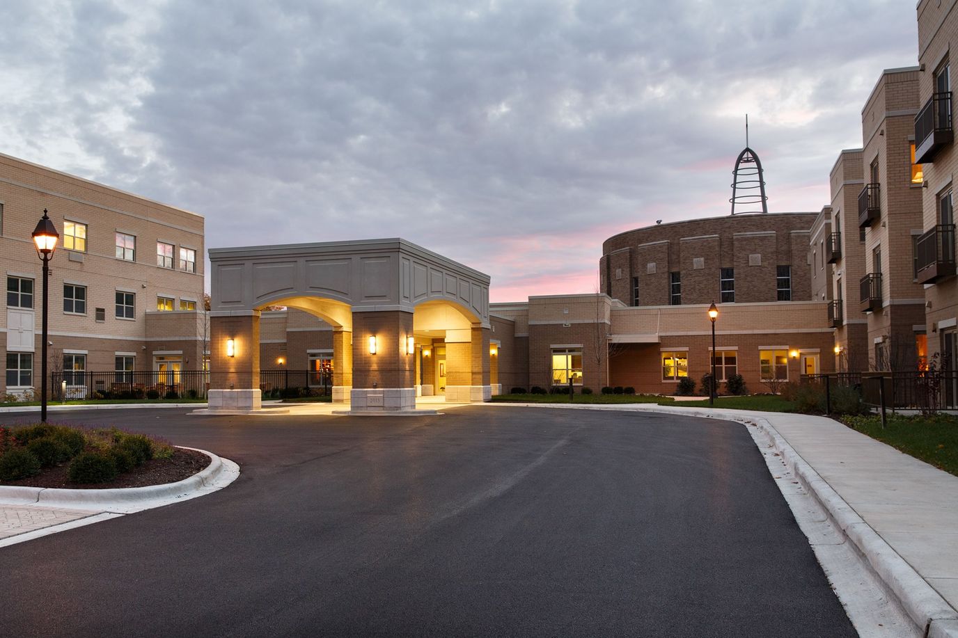 Exterior view of Mercy Circle Senior Living at dusk