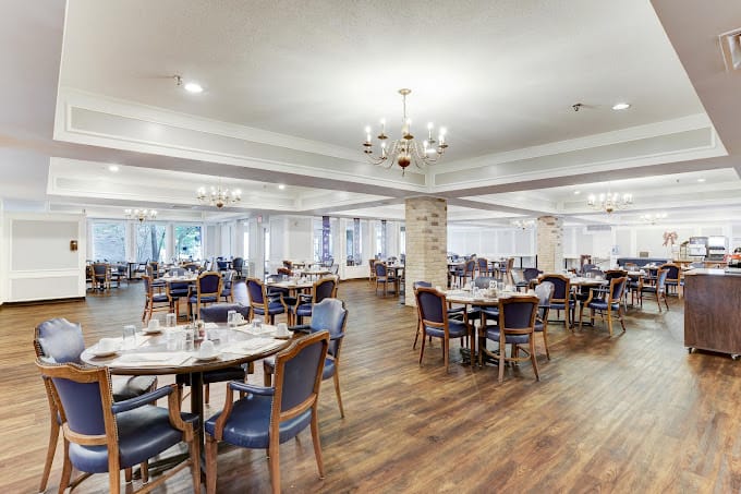 Dining room with elegant seating arranged for residents
