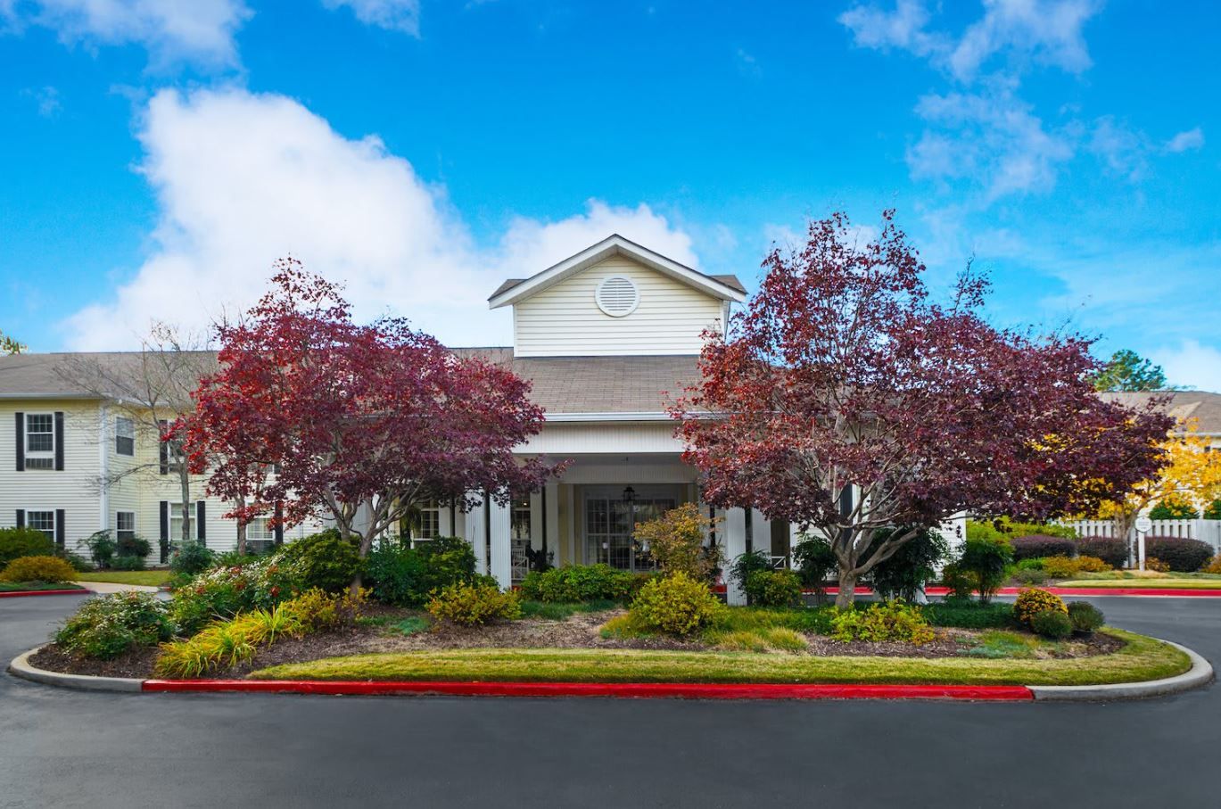 Exterior view of Arbor Terrace of Athens with colorful landscaping
