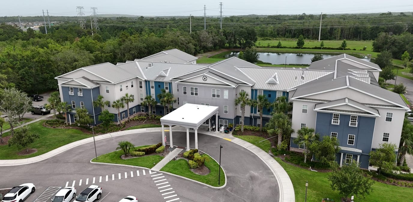 Aerial view of the facility with landscaped grounds
