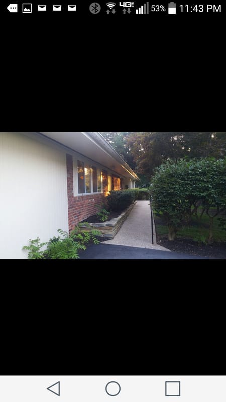 Pathway leading to a brightly lit assisted living building