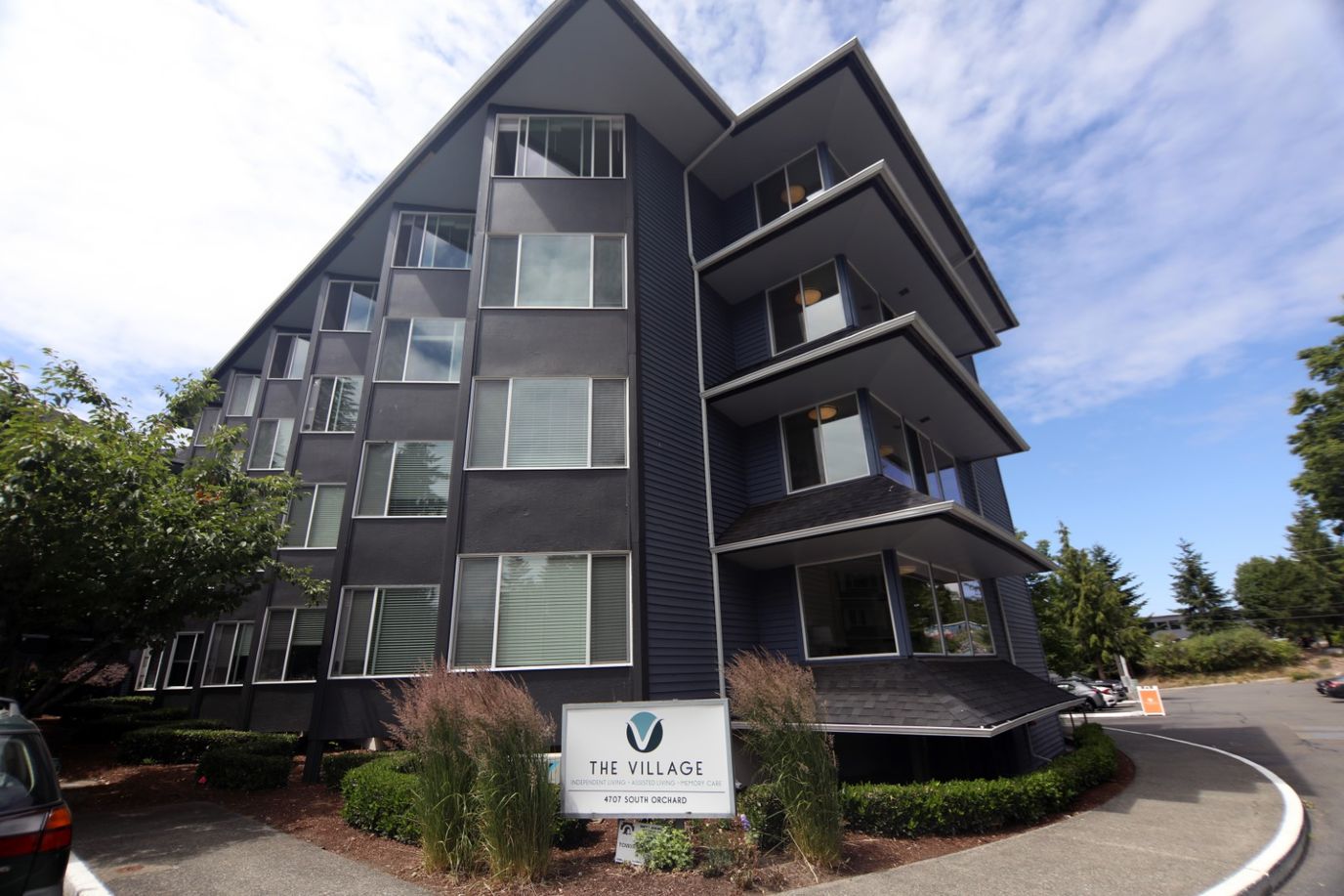 Exterior view of The Village Senior Living building