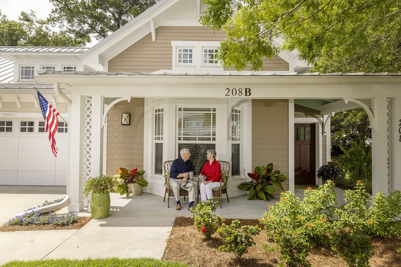 Two residents enjoying conversation on a porch