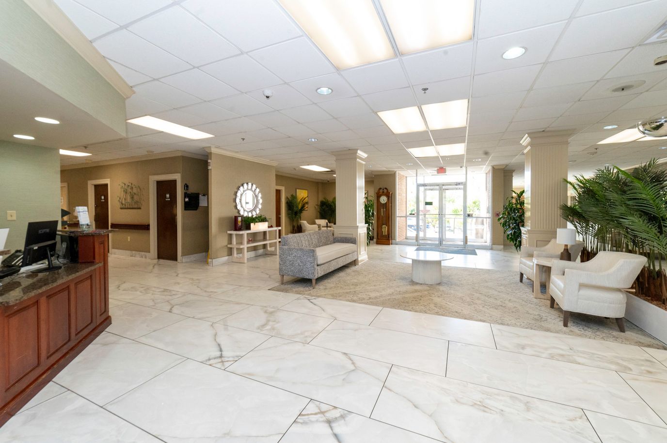 Bright and inviting common area with seating and plants.