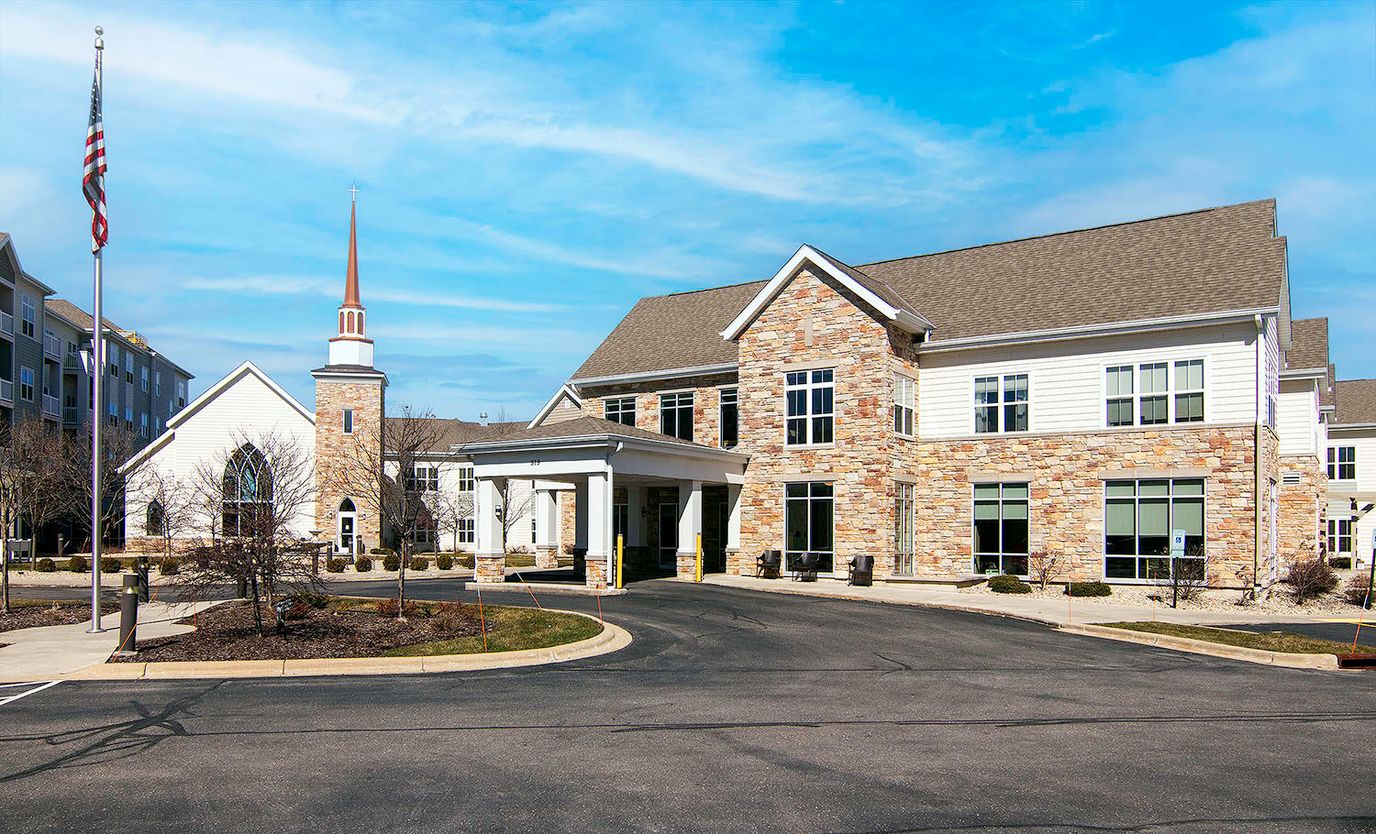 Exterior view of All Saints Neighborhood facility with church