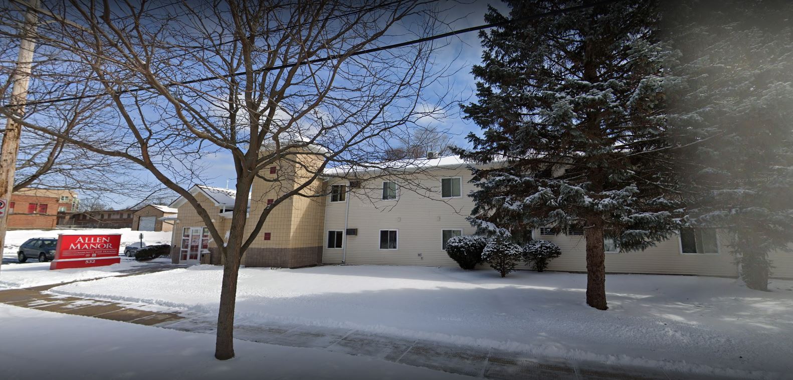 Exterior view of Allen Manor Senior Housing in winter