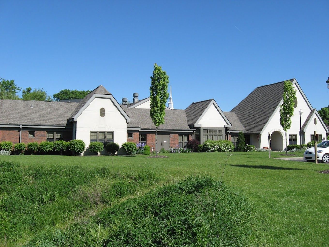 Exterior view of Asbury Heights facility with well-maintained grounds