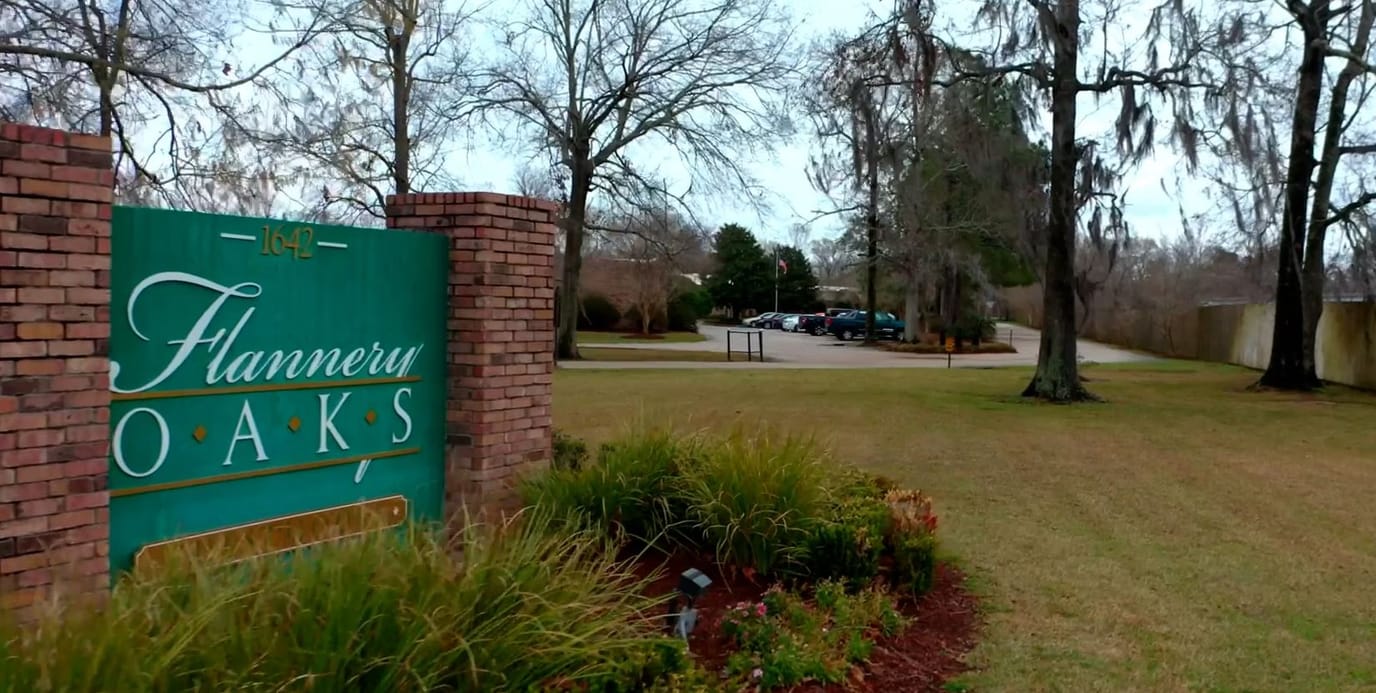 Entrance sign for Flannery Oaks with landscaped area