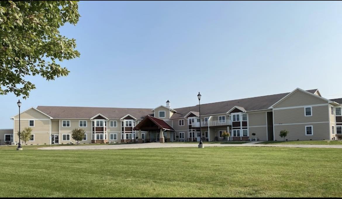 Exterior view of Garden View Place with lawn and buildings