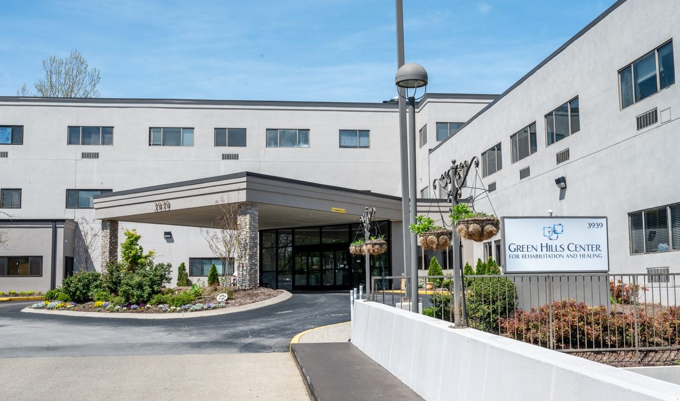 Exterior view of Green Hills Center with landscaped entrance