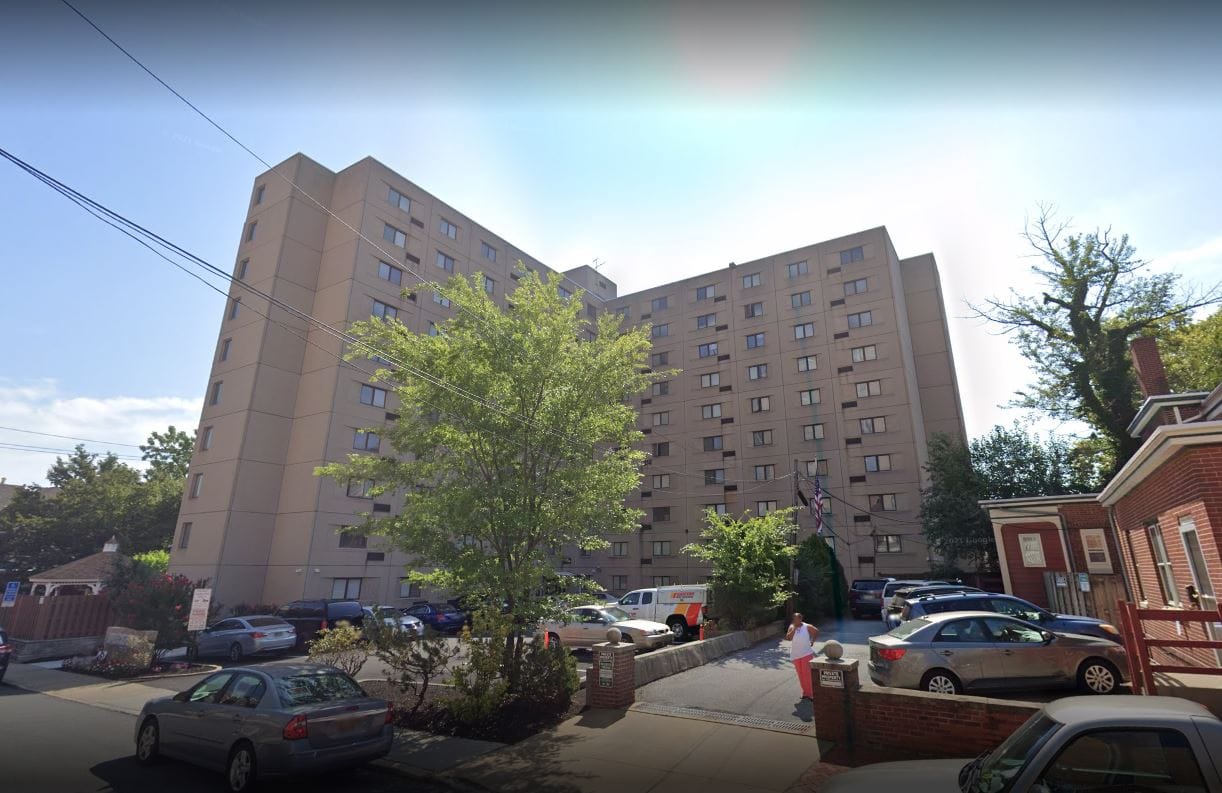 Exterior view of Lutheran Towers with parking area