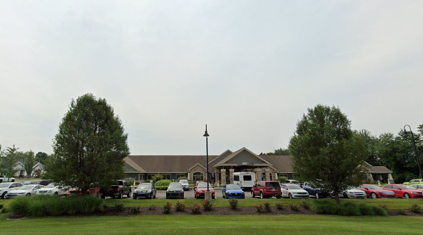 Exterior view of Medilodge of Wyoming with parked cars