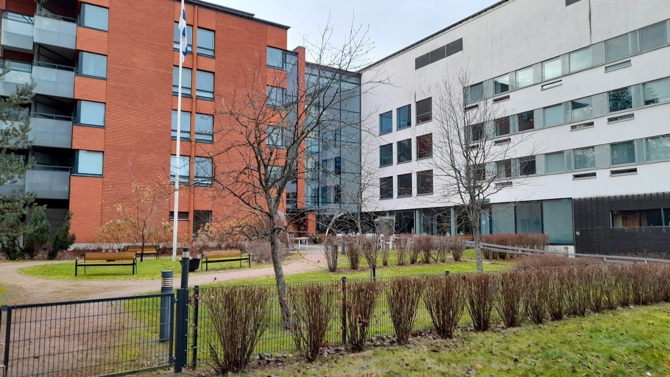 Exterior view of the facility with outdoor space and landscaping