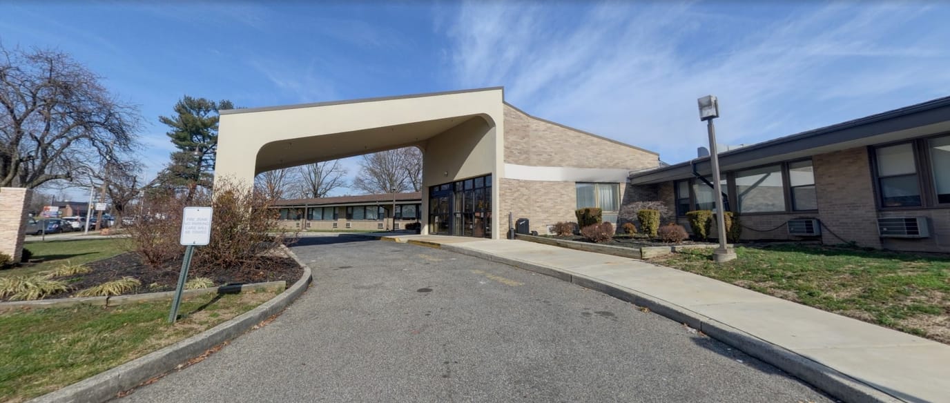 Entrance of Oakwood Residence with clear sky