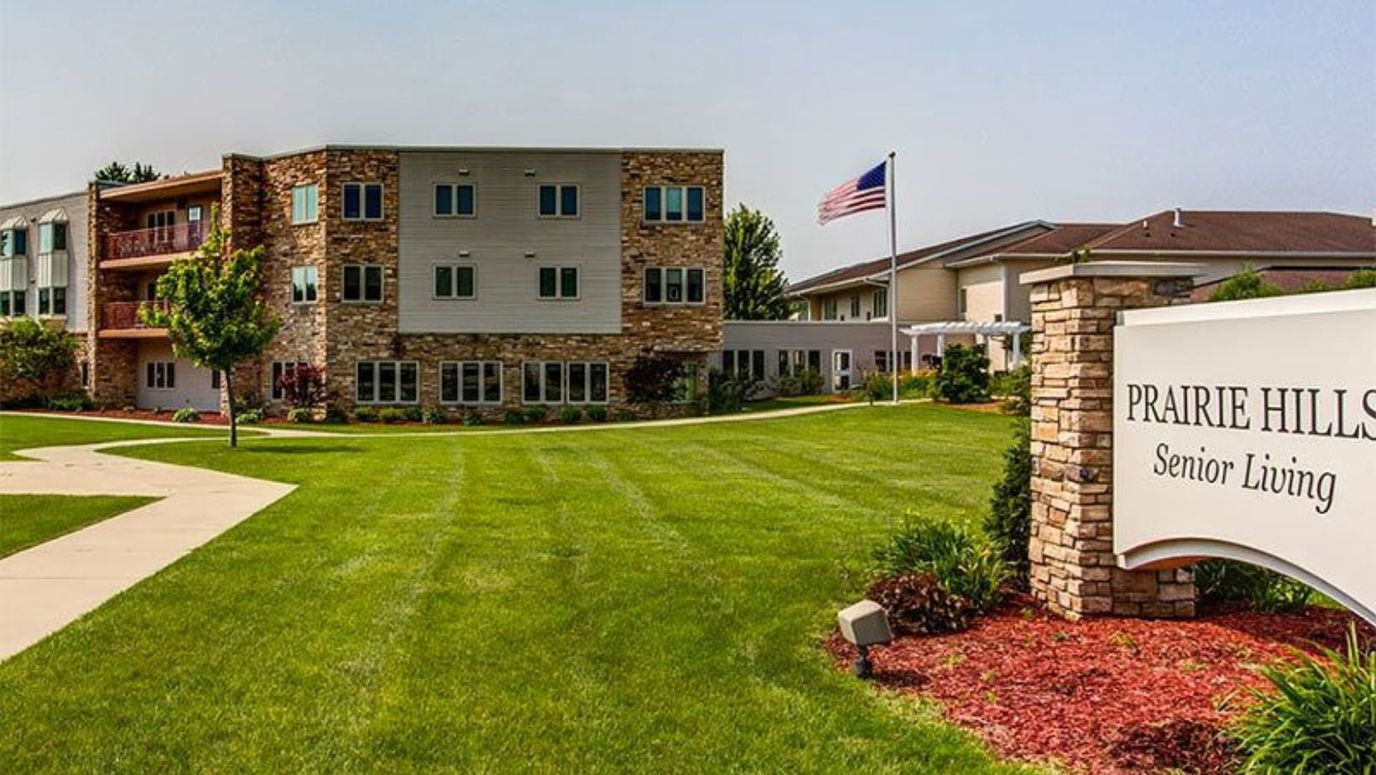 Exterior view of Prairie Hills at Cedar Rapids with landscaped grounds