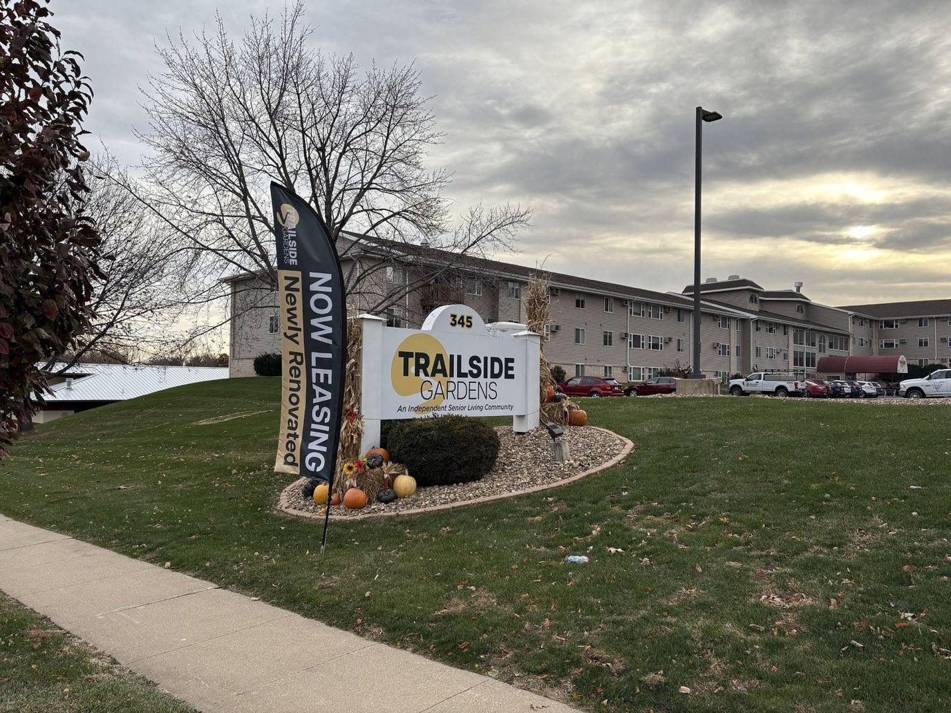 Exterior view of Trailside Gardens facility with signage