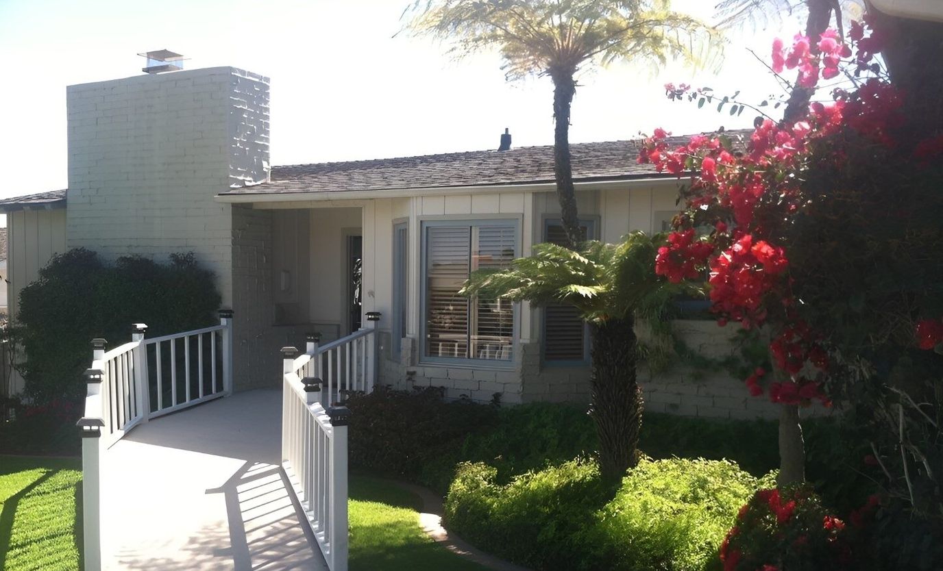 Exterior view of a senior care facility with landscaping