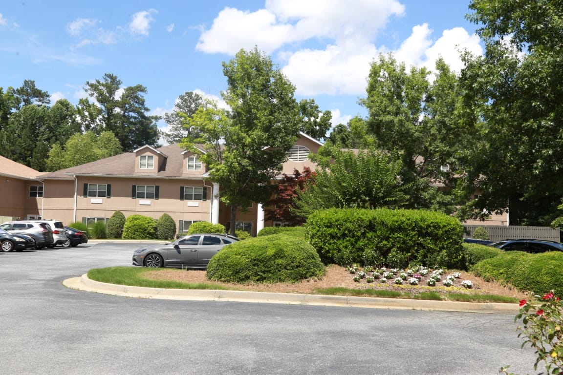 Exterior view of Summerset Assisted Living with landscaped garden