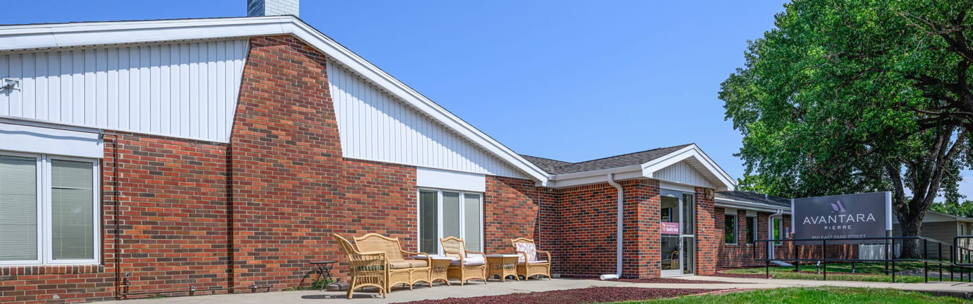 Exterior view of Avantara Pierre facility with seating