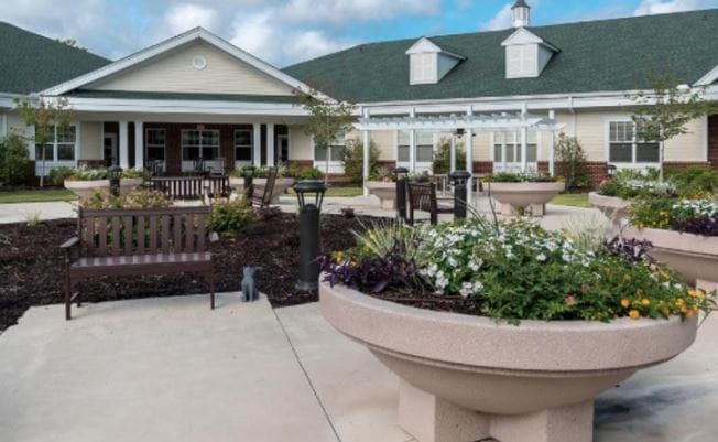 Outdoor courtyard with benches and flower beds