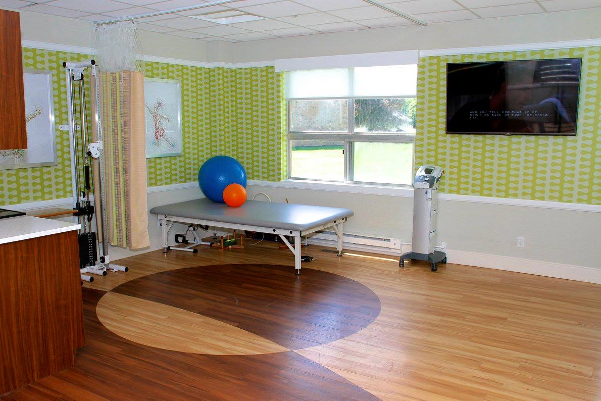 Rehabilitation room with exercise equipment and therapy ball
