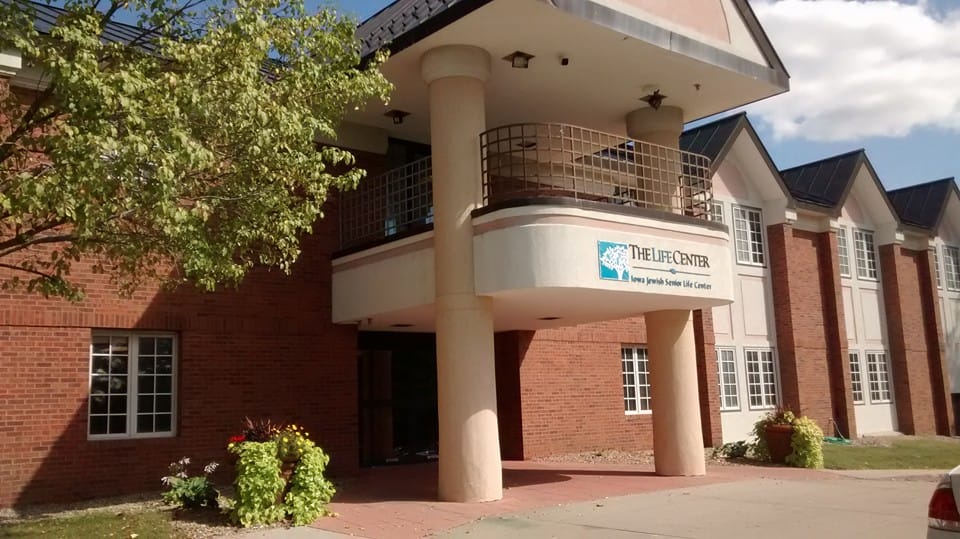 Exterior view of The Life Center with entrance and signage