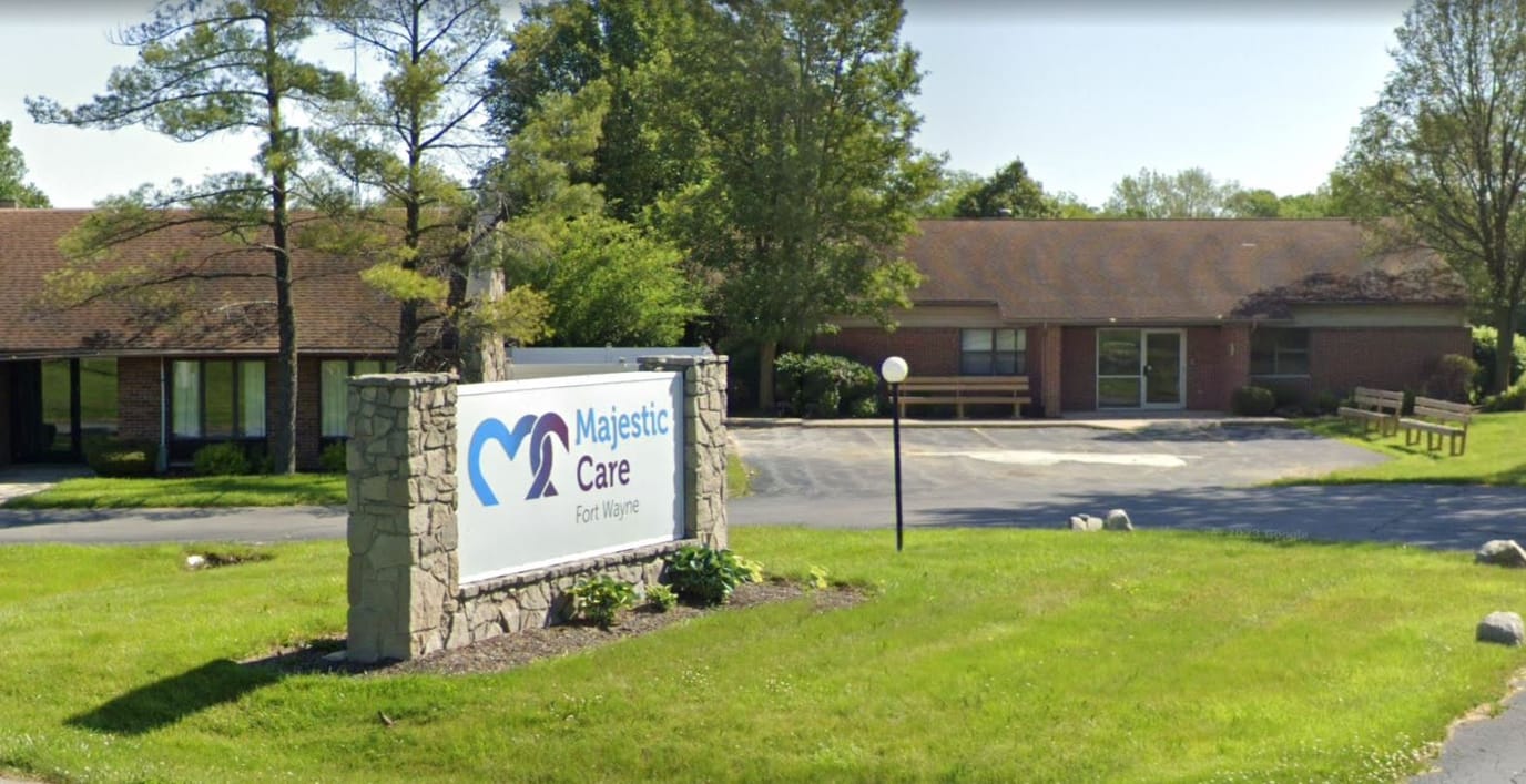 Exterior view of Majestic Care facility with sign visible