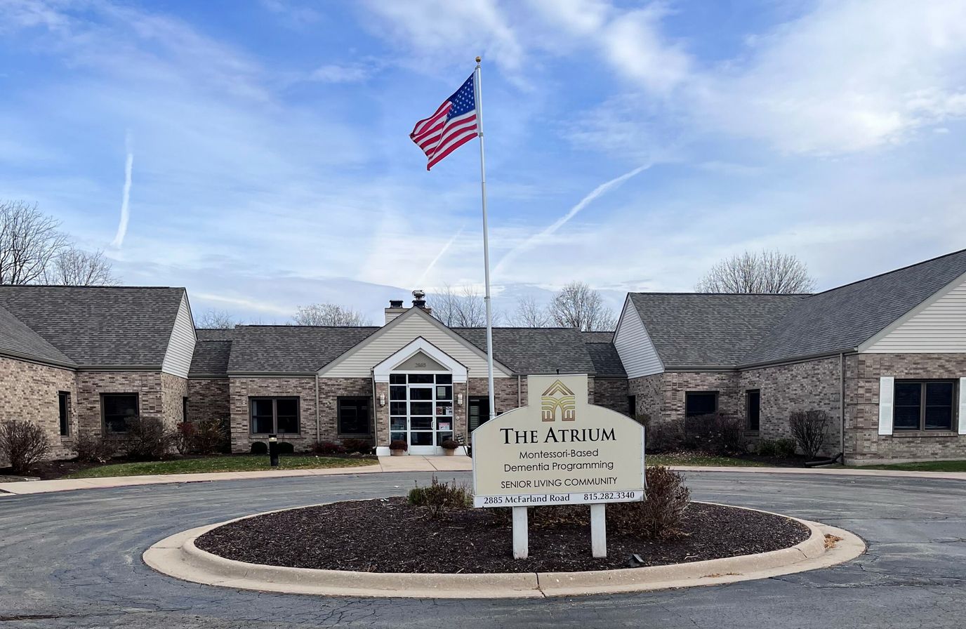 Exterior view of The Atrium facility with flag