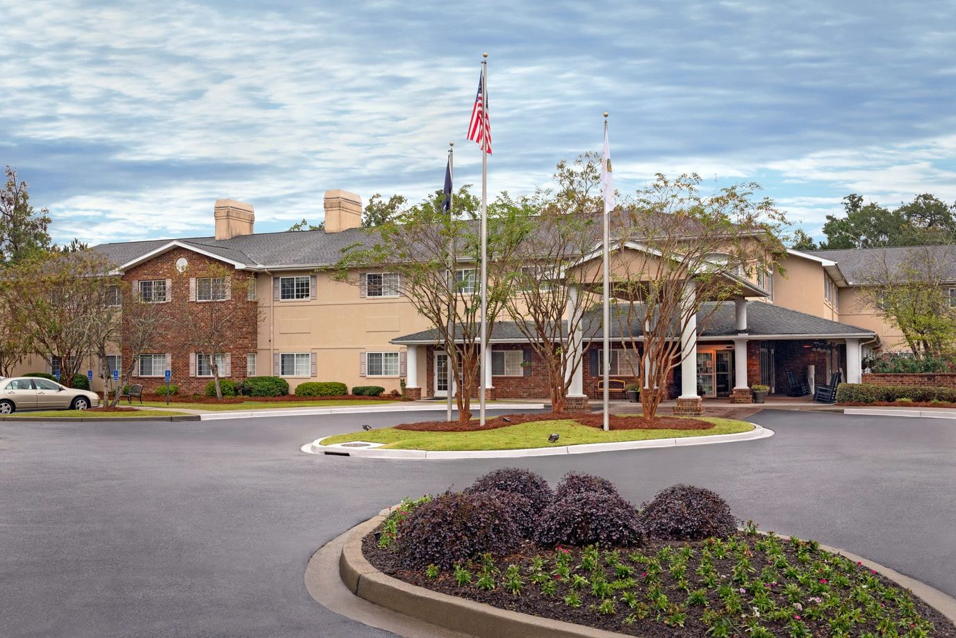 Exterior view of The Bridge at Charleston with landscaped entrance