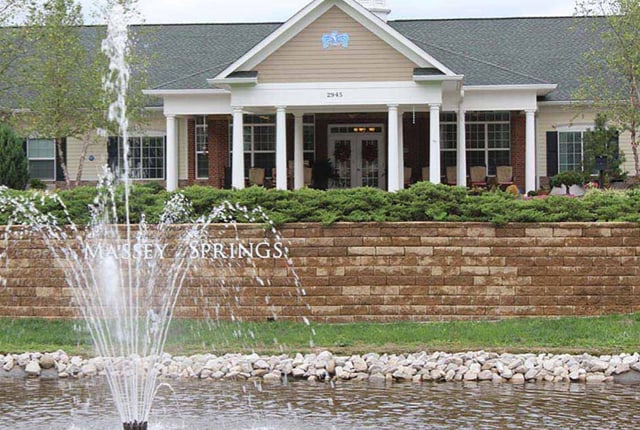 Exterior view of Massey Springs Senior Living with fountain