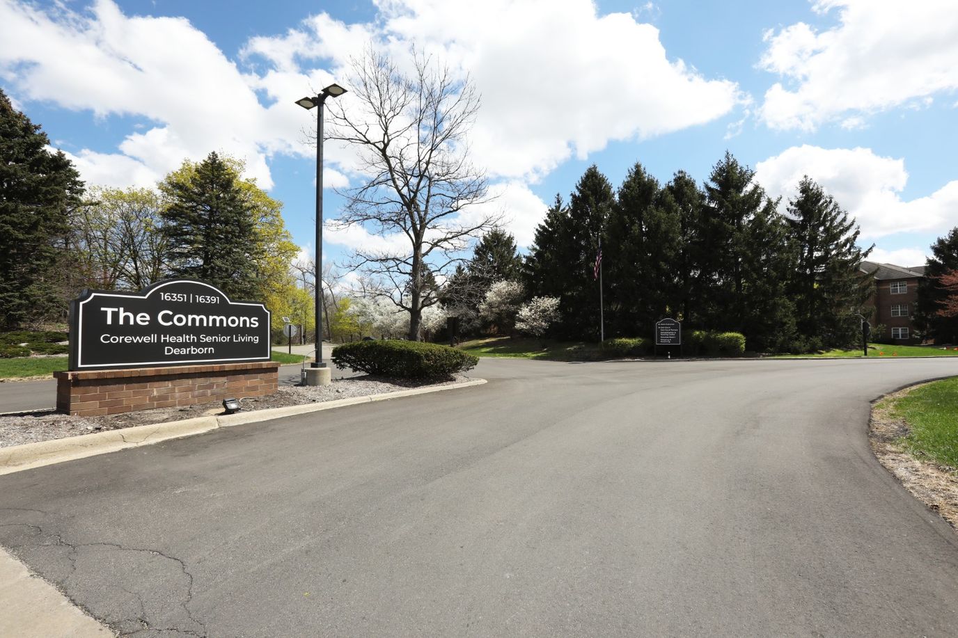 Entrance sign of The Commons Corewell Health facility