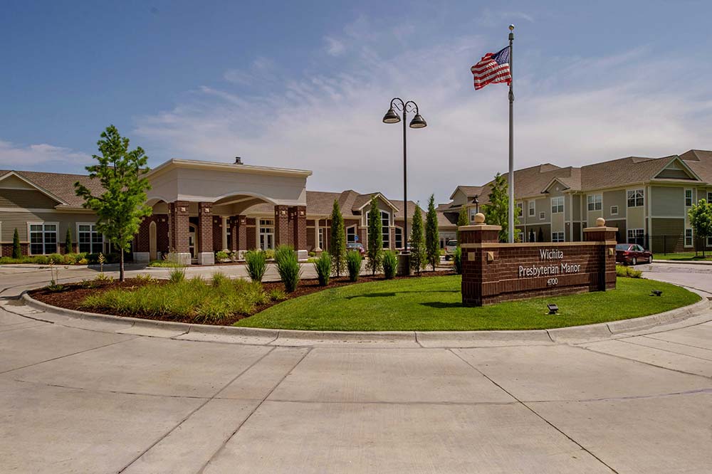 Exterior view of Wichita Presbyterian Manor with landscaped entrance
