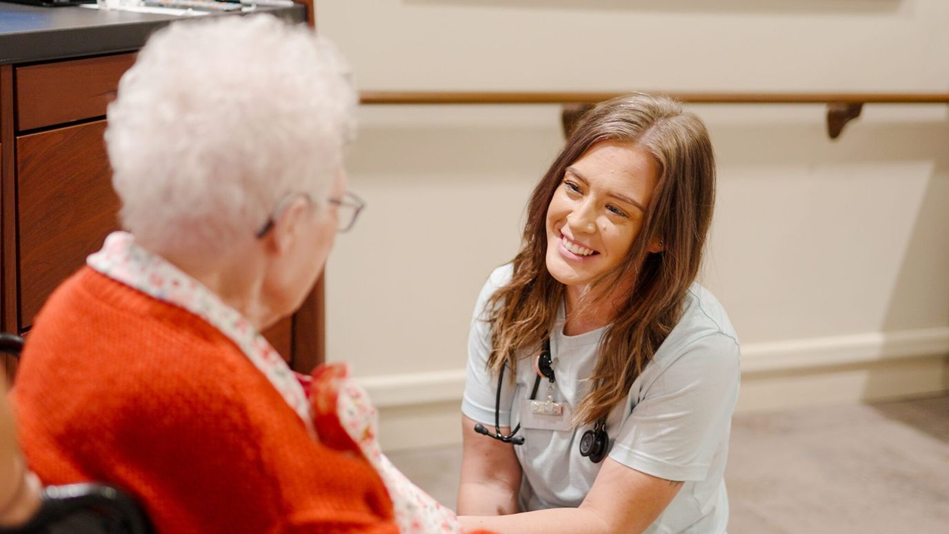 A staff member interacting with a resident