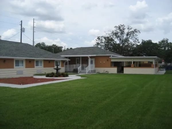 Exterior view of assisted living facility with outdoor space