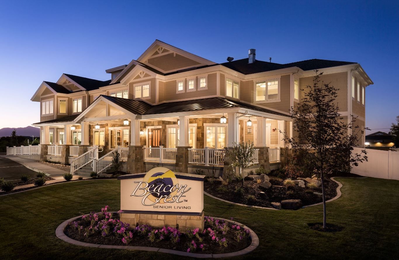 Exterior view of Beacon Crest Senior Living at dusk