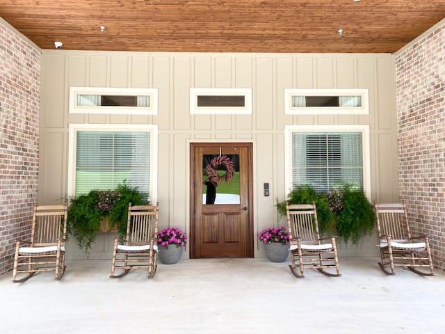 Entrance of a senior care facility with rocking chairs