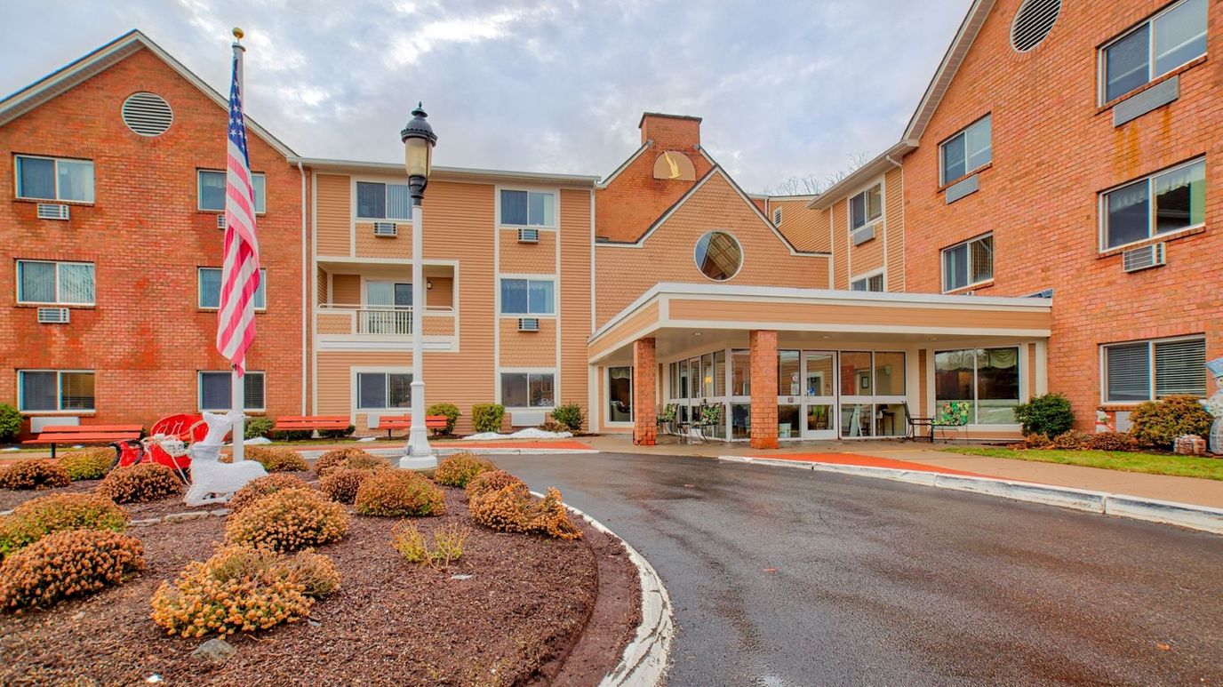 Exterior of Chapel Hill Senior Living with landscaped entrance