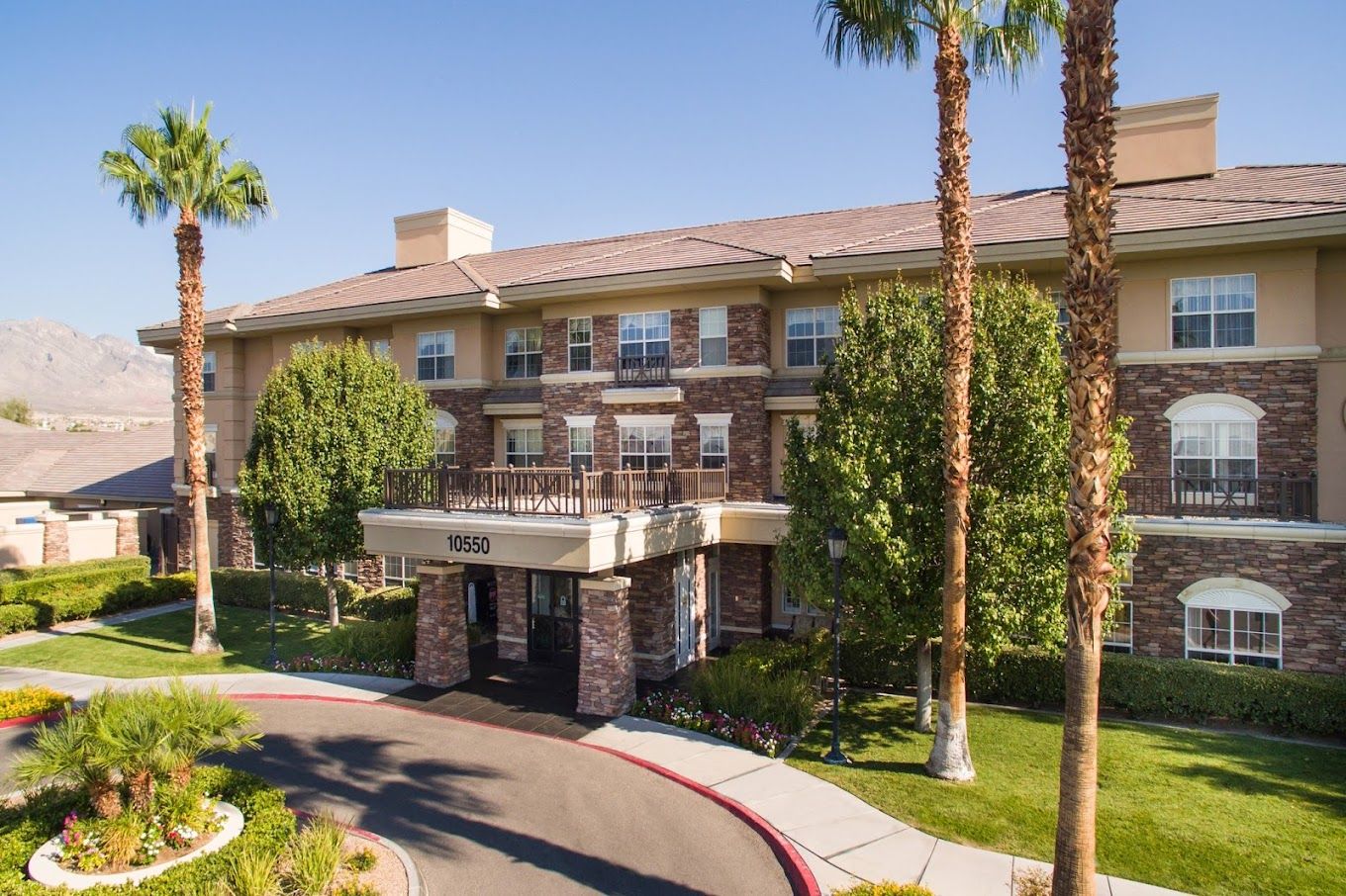 Exterior view of The Heights of Summerlin building with landscaping